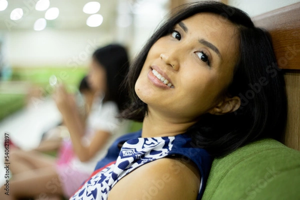 Obraz pregnant woman sitting and waiting for turn to check her baby to the doctor