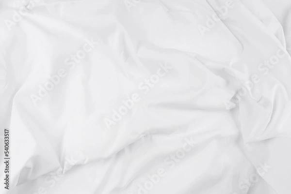 Fototapeta White fabric. luxurious white fabric texture background. Creases of satin, silk, and cotton.