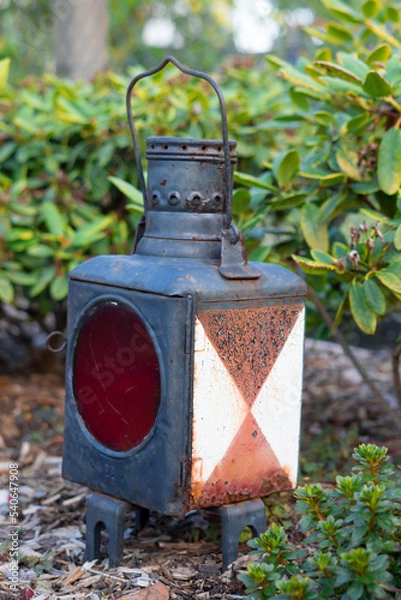 Obraz old lantern in the garden