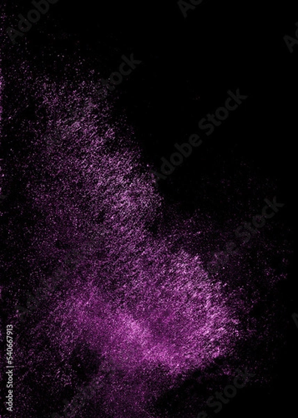 Fototapeta Purple sequins glisten with dust isolated on a black background. Vertical abstract background with sparkling dust