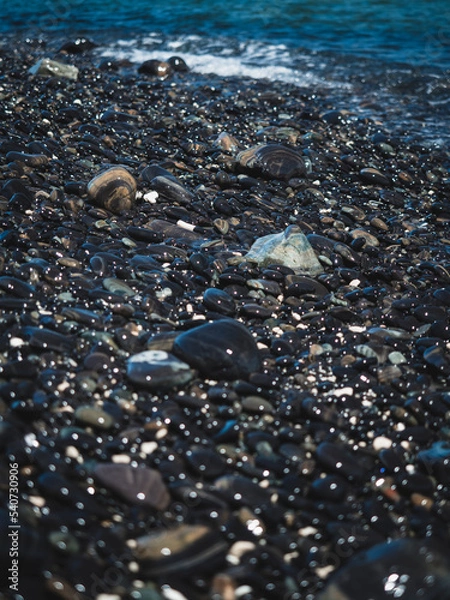 Fototapeta Scenic close up view of Koh Hin Ngam Island iconic black round pebble stone beach. Near Koh Lipe Island, Tarutao National Marine Park, Satun, Thailand. Selective focus, blurred foreground.