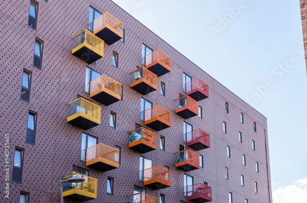Obraz London, England, United Kingdom, 9 October 2022: Bright colourful building materials on apartment block balconies in housing development in modern block of homes in East London flats