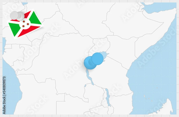 Fototapeta Map of Burundi with a pinned blue pin. Pinned flag of Burundi.