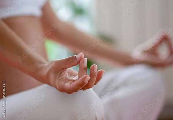 Fototapeta Woman meditating in yoga asana