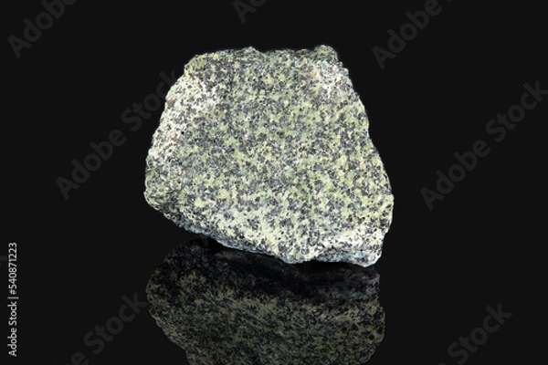 Fototapeta The mineral chromite is gray in color with black inclusions on the surfac
