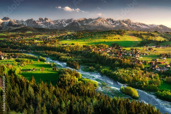 Fototapeta A view of the Tatra Mountains, the Białka River and Podhale from Czarna Góra. Summer, Poland.  Widok na panoramę Tatr, rzekę Białka i podhale, z Czarnej Góry. Zachód słońca, lato, Polska. 