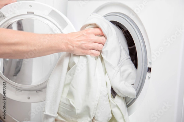 Obraz Filling the Washing Machine