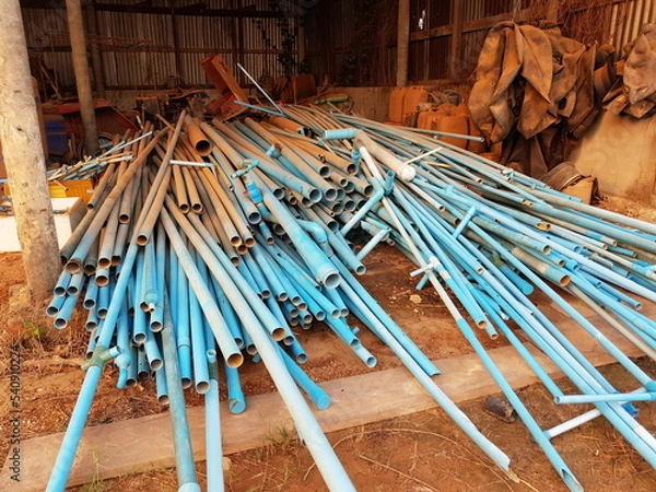 Fototapeta Plastic waste solution dump pile, Industrial scrap plastic on garbage shed, A lot of waste to be reused in the plastics industry, industrial waste background, plastic pipe waste.