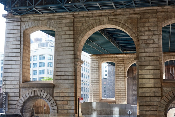 Obraz The granite structural supports of the Manhattan bridge on Pearl St in the Dumbo neighborhood of Brooklyn, NYC.