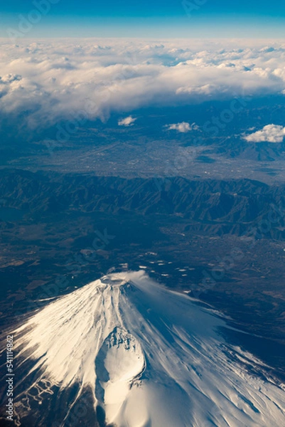 Fototapeta Bird Eye View shot of Fuji Mountain at Japan on Airplane with Blue Sky and Cloud