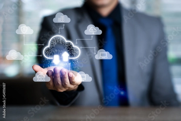 Fototapeta Cloud computing concept - Information technologist connect devices to cloud with cloud computing icon on hand
