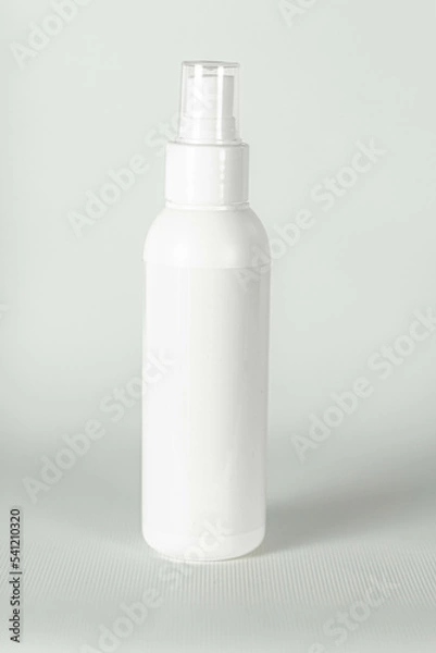 Obraz White plastic bottle for spraying on a light gray background. Vector template for advertising, cosmetic or chemical products.