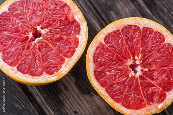 Fototapeta red grapefruit on old table