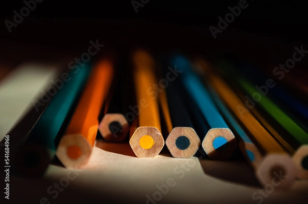 Fototapeta The ends of multicolored pencils. Colored pencils background. Selective focus.  