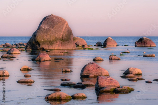 Obraz Beautiful colorful sunset landscape on the rocky shore of a peaceful sea. High quality photo