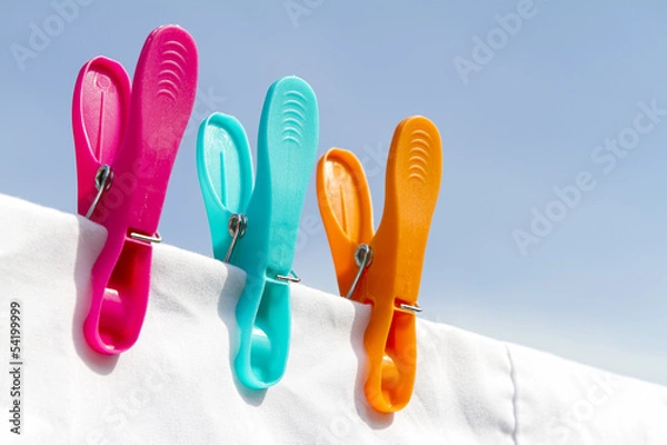 Obraz Three clothes pegs on a line