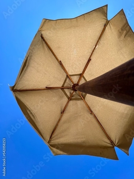 Obraz Beach umbrella against blue sky