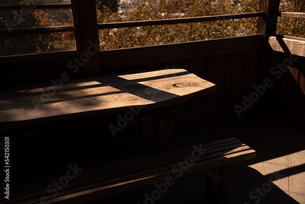 Obraz 和風のテラス席に差し込む哀愁漂う夕日