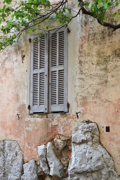 Fototapeta Wooden blinds of a window in an old building