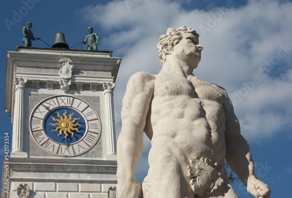 Obraz A view of Piazza Libertà in Udine, North Italy. Details of clock tower and Hercules statue