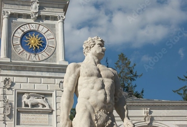 Obraz A view of Piazza Libertà in Udine, North Italy. Details of the clock tower and Hercules statue