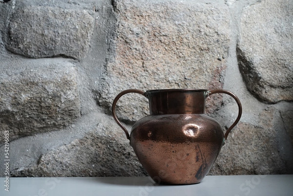 Obraz copper vase in rustic house