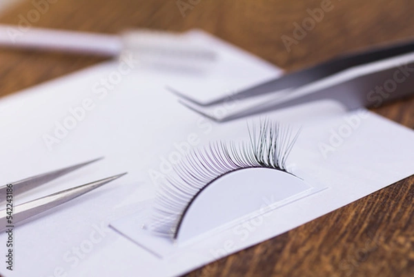 Fototapeta Eyelash extension set and training eyelash extension on the tester on the table