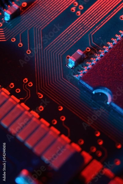 Fototapeta Computer cpu processor chip on circuit board ,motherboard background. Close-up. With red-blue lighting