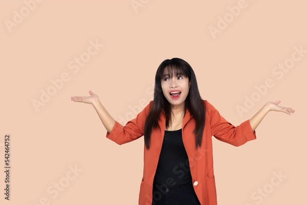 Fototapeta close up attractive adult business woman asian girl raise fists celebrate achievement with happy and smile against white concrete wall office with concrete background and blank copy space.