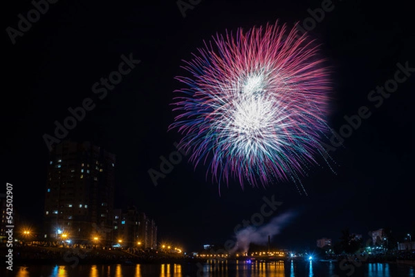 Obraz fireworks over the river in the city