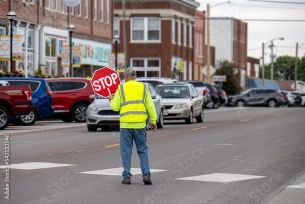 Fototapeta crossing guard with stop sign