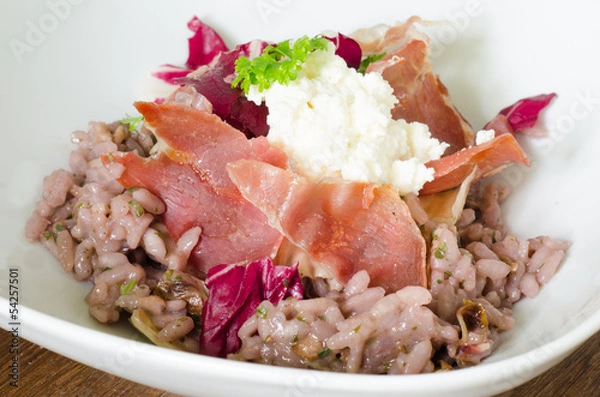 Obraz Red wine risotto with fried ham and salad