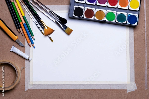 Fototapeta White drawing paper watercolor cartridges multi-sized brushes color pencils paper Masking tape color tube