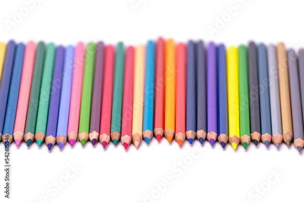 Obraz Multi-colored pencils, arranged, sharpened, on a white background, blurry background.