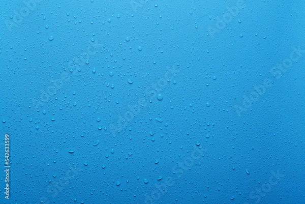 Fototapeta Water drops on blue background and texture