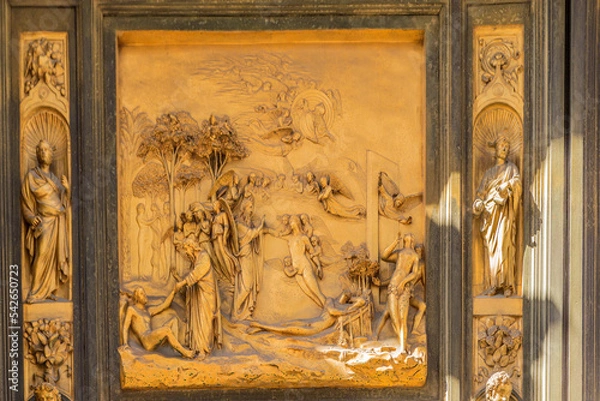 Fototapeta Florence, Italy. Baptistery (UNESCO). Fragment of the Eastern Gate. Lorenzo Ghiberti "Creation of Adam and Eve, original sin. An angel casts out Adam and Eve from heaven", 1425-1452