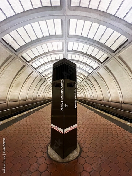 Fototapeta The Cleveland Park Metro Station platform tunnel, with no people visible, in Washington, DC. The station is part of the Washington metro area transit authority system (WMATA)