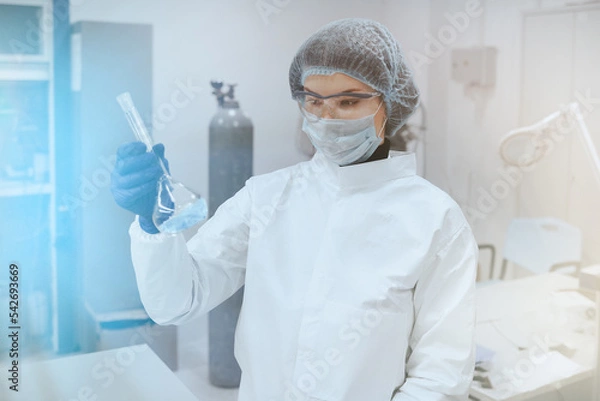 Obraz Medical worker or Scientist in a medical research laboratory holds a test tube. Biochemical analysis