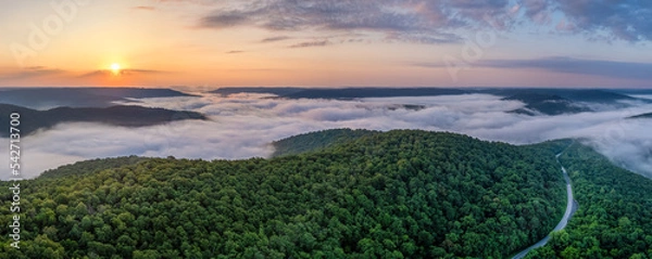 Obraz A foggy sunrise over the Arkansas Ozark Mountains - Calftail Cut on Hightway 43 near Centerpoint