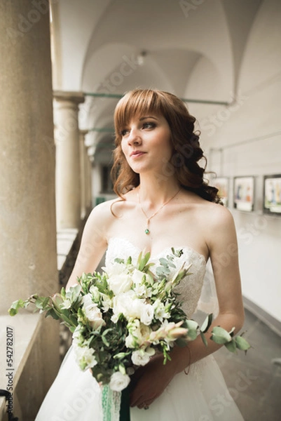 Obraz Bride holding big and beautiful wedding bouquet with flowers