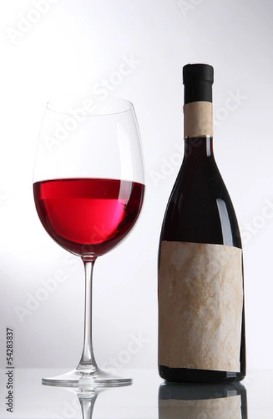 Obraz Glass of wine with bottle isolated on white