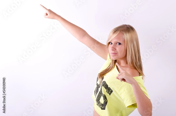 Fototapeta Young blonde model pointing upwards
