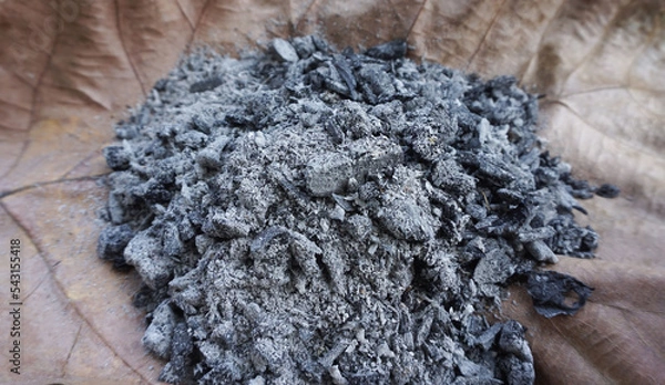 Fototapeta Small pieces of charcoal for cooking and heating in winter.