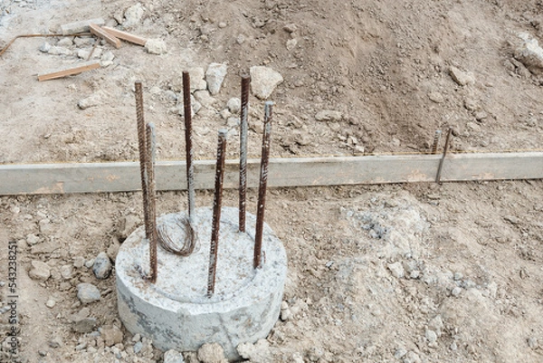 Obraz Monolithic foundation with metal reinforcement. Concrete Pile foundation after completed for new construction site.