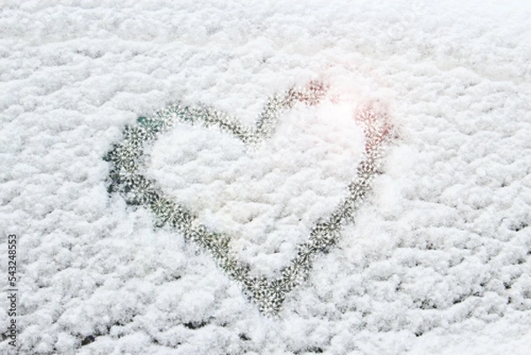Fototapeta Winter decoration. Snow heart. Hearty congratulations on the winter holidays. Creating a good mood. Background.