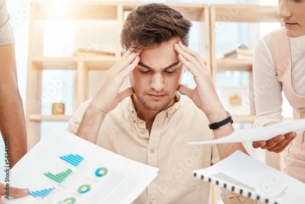 Fototapeta Stress, young man and headache being overworked, upset and tired in office. Business, employee and male experience burnout, frustrated and depressed with multiple task with anxiety and mental health.
