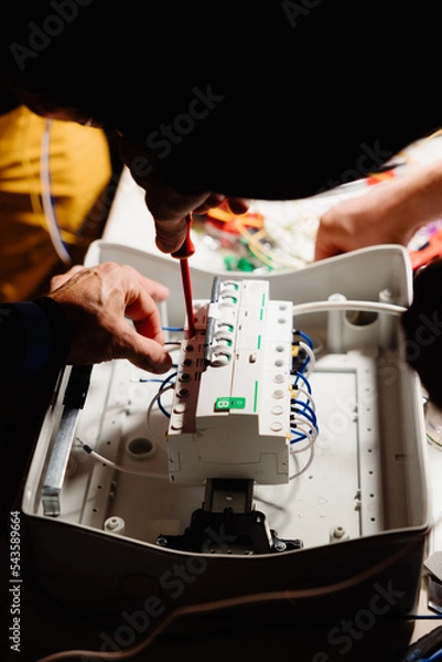 Obraz Electrician works cable checking energy