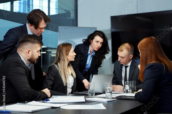 Fototapeta Business people discussing progress at meeting in office