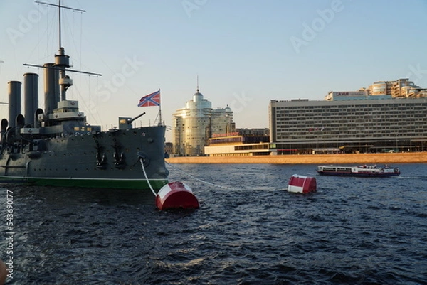 Fototapeta Saint Petersburg, Russia - August 19, 2022: Aurora (Avrora) cruiser in Saint-Petersburg. Russian cruiser Aurora. Aurora museum ship in St. Petersburg.