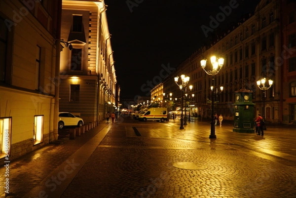 Fototapeta Beautiful night street with lighting in St. Petersburg. Saint Petersburg, Russia - August 20, 2022: